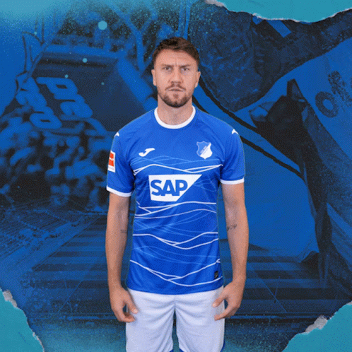 A Man Is Wearing A Blue Shirt With The Word Sap On It GIF