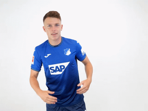 A Man Is Wearing A Blue Shirt With The Word Sap On It GIF