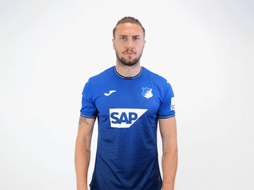 a man is wearing a blue shirt with the word sap on it