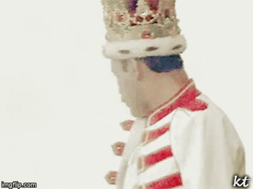 A Man Is Wearing A Crown And Holding A Drum In His Hand . GIF