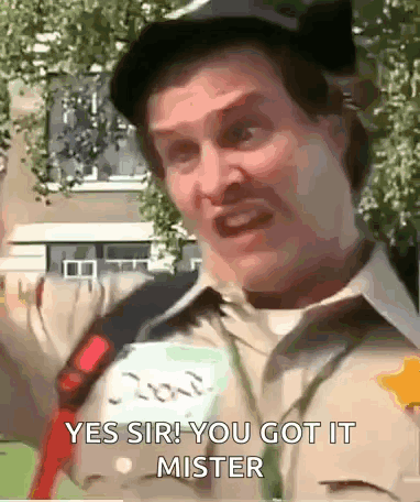A Man Is Wearing A Hat And A Name Tag That Says ' Yes Sir You Got It Mister ' On It . GIF