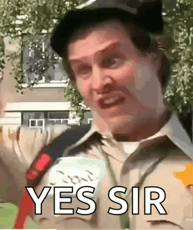 A Man Is Wearing A Hat And A Shirt That Says Yes Sir . GIF