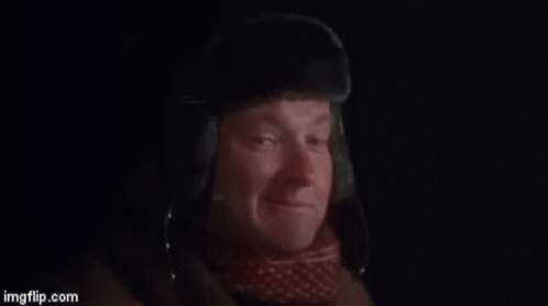 A Man Is Wearing A Hat And Saying Bingo . GIF