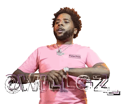 a man is wearing a pink shirt that says palacitos on it