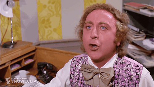 A Man Is Wearing A Purple Vest And Bow Tie And A Fandango Movie Clip GIF