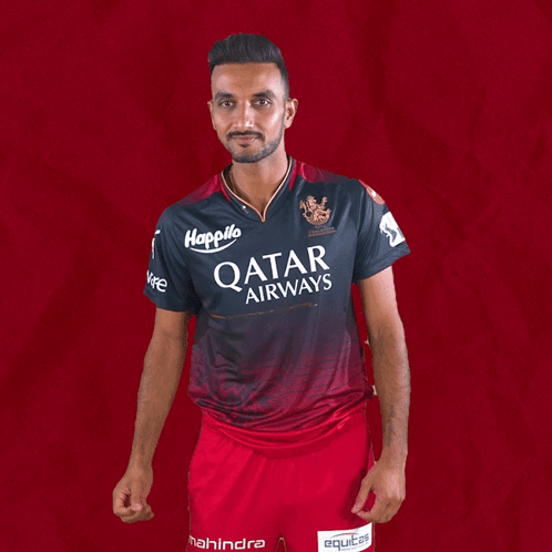 A Man Is Wearing A Qatar Airways Shirt GIF