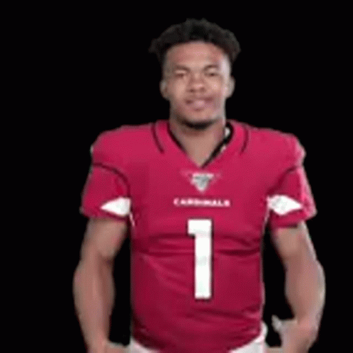 A Man Is Wearing A Red Cardinals Jersey And Dancing . GIF