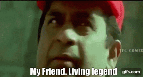 A Man Is Wearing A Red Hat And Says " My Friend Living Legend " GIF