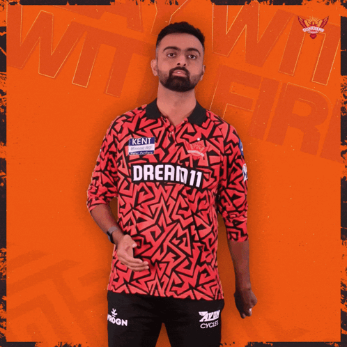 A Man Is Wearing A Red Shirt That Says Dream11 GIF