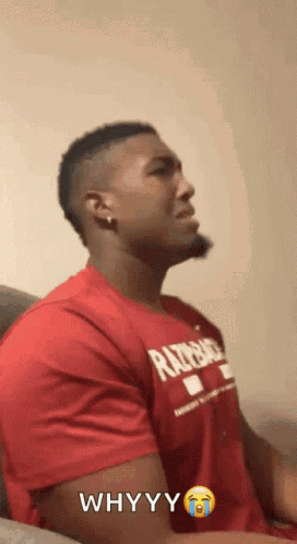 A Man Is Wearing A Red Shirt That Says Whyyy GIF