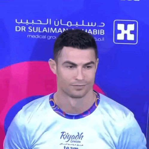 A Man Is Wearing A Shirt That Says Riyadh Season GIF