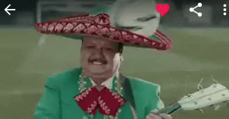 A Man Is Wearing A Sombrero And Playing A Guitar . GIF