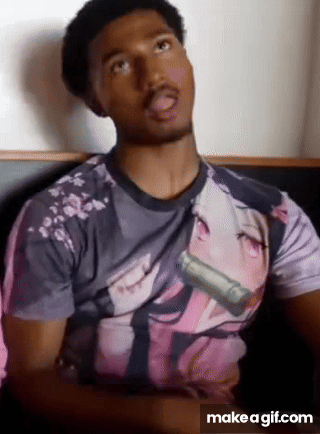 A Man Is Wearing A T-Shirt With A Picture Of A Girl On It . GIF
