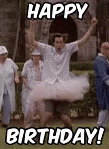 A Man Is Wearing A Tutu And Jumping In The Air While A Group Of People Are Walking Behind Him . GIF