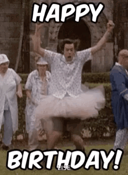 A Man Is Wearing A Tutu And Jumping In The Air While A Group Of People Celebrate His Birthday . GIF