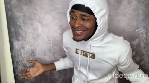 A Man Is Wearing A White Hoodie That Says That 'S Tuff GIF