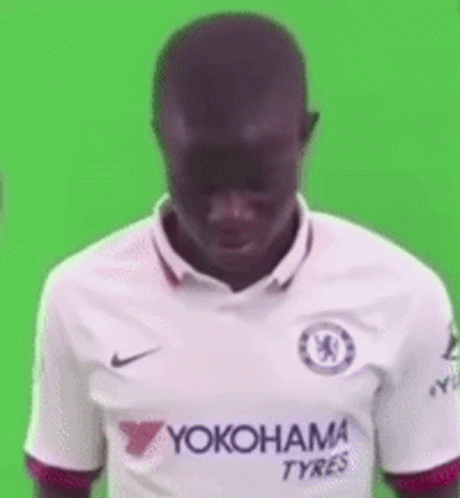 A Man Is Wearing A White Yokohama Tyres Jersey . GIF