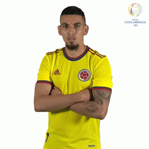 A Man Is Wearing A Yellow Adidas Shirt GIF