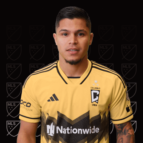 A Man Is Wearing A Yellow Jersey That Says Columbus Crew On It GIF
