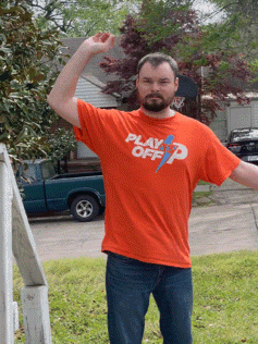 A Man Is Wearing An Orange Shirt That Says Play Off GIF