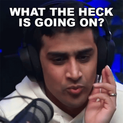 A Man Is Wearing Headphones And Asking What The Heck Is Going On GIF