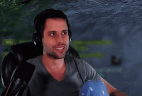 A Man Is Wearing Headphones And Holding A Microphone In Front Of A Party Sign GIF