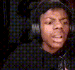 A Man Is Wearing Headphones And Making A Funny Face . GIF