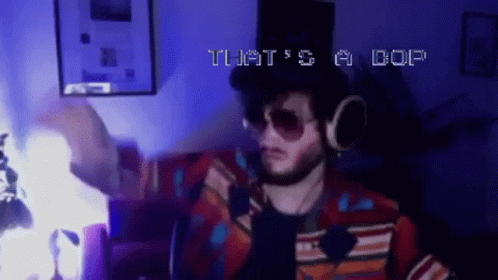 A Man Is Wearing Headphones And Sunglasses And Says That 'S A Cop GIF