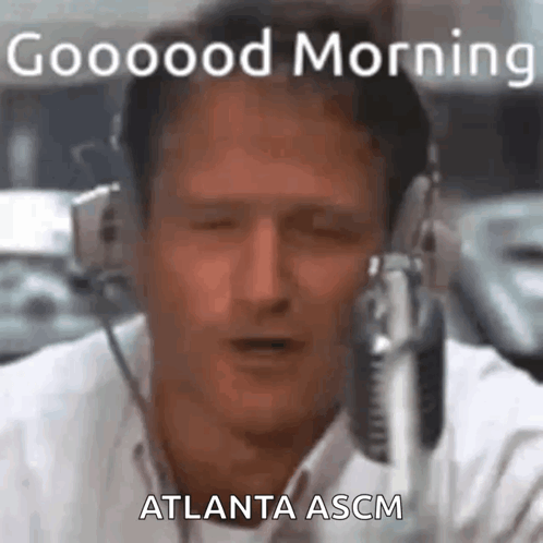 A Man Is Wearing Headphones And Talking Into A Microphone While Saying Good Morning Atlanta Ascm . GIF
