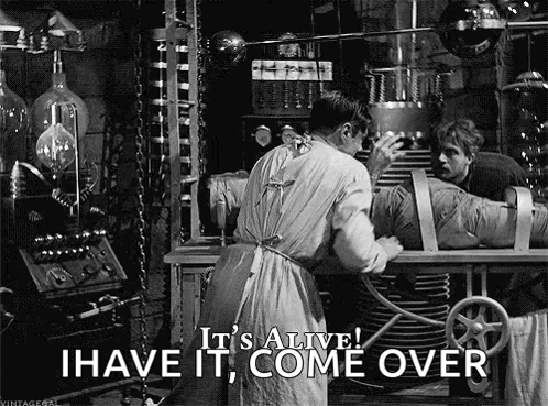A Man Is Working On A Mummy In A Laboratory And Says `` It 'S Alive ! I Have It Come Over '' GIF
