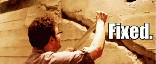 A Man Is Working On A Wall And The Word Fixed Is Above Him GIF