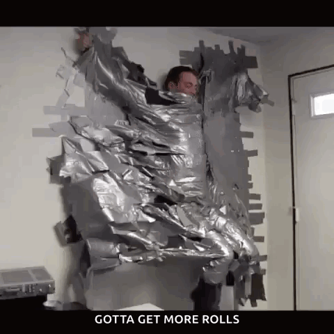 A Man Is Wrapped In Duct Tape And Says Gotta Get More Rolls On The Bottom . GIF
