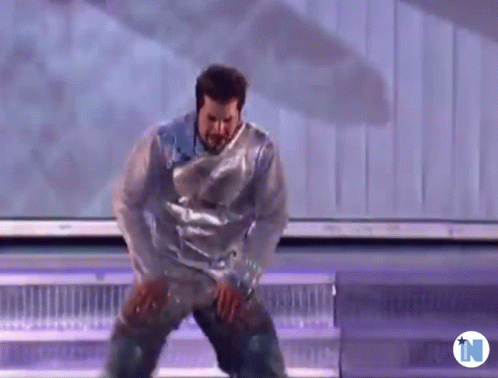 Man Dancing Wrapped In Plastic Wrap GIF