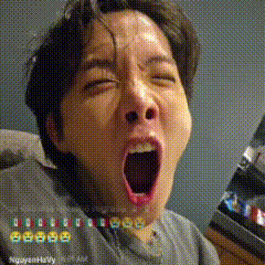A Man Is Yawning With His Mouth Open In A Pixelated Photo . GIF