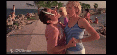 A Man Kissing A Woman On The Cheek In A Movie Clip GIF