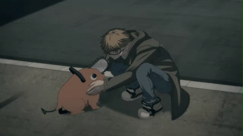 A Man Kneeling Down With A Chainsaw Dog GIF