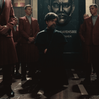 A Man Kneeling In Front Of A Heavensbee Sign GIF