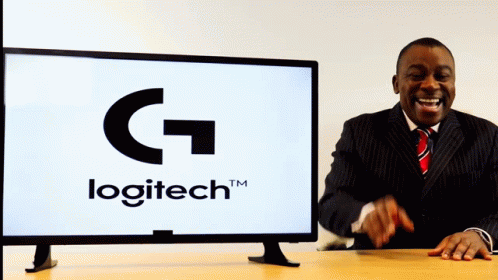 A Man Laughs In Front Of A Logitech Logo GIF