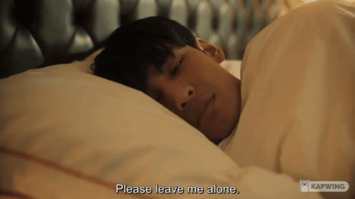 A Man Laying In Bed With The Words Please Leave Me Alone GIF