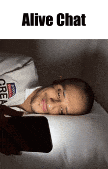 A Man Laying On A Bed Looking At A Cell Phone With The Words " Alive Chat " Above Him GIF