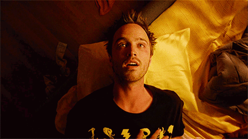 A Man Laying On A Bed Wearing A T-Shirt That Says 1 2 3 GIF