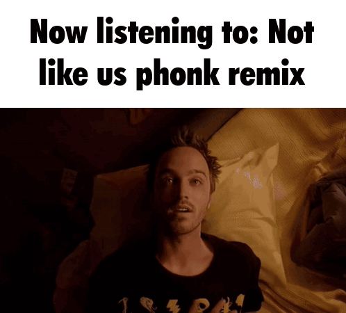 a man laying on a bed with the words now listening to : not like us phonk remix above him