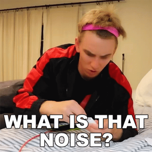 A Man Laying On A Bed With The Words " What Is That Noise " GIF