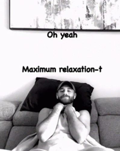 A Man Laying On A Couch With The Words Oh Yeah Maximum Relaxation-T On The Bottom GIF