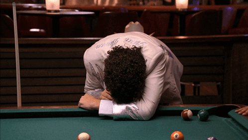A Man Laying On A Pool Table With The Word Prince On His Back GIF