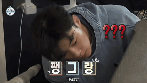 A Man Laying On His Stomach With A Question Mark Above Him In Red GIF