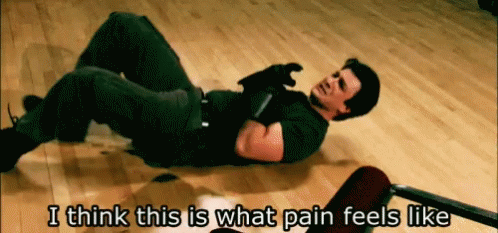 A Man Laying On The Floor With The Words " I Think This Is What Pain Feels Like " Below Him GIF