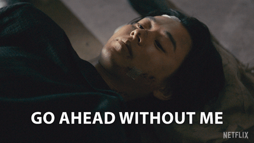 A Man Laying On The Ground With The Words Go Ahead Without Me Written Below Him GIF