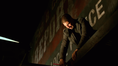 A Man Leaning Over A Railing With The Words " They Better Not Miss " Behind Him GIF