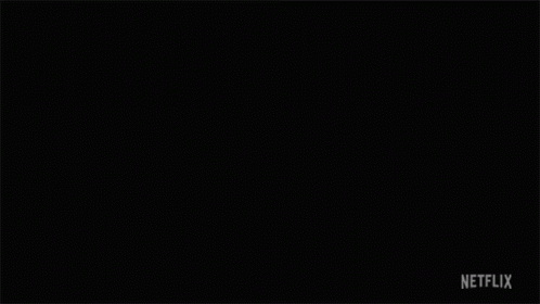 A Man Lighting A Match Next To Another Man With A Netflix Logo On The Bottom GIF